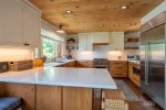 Chef`s Kitchen with counter and stools